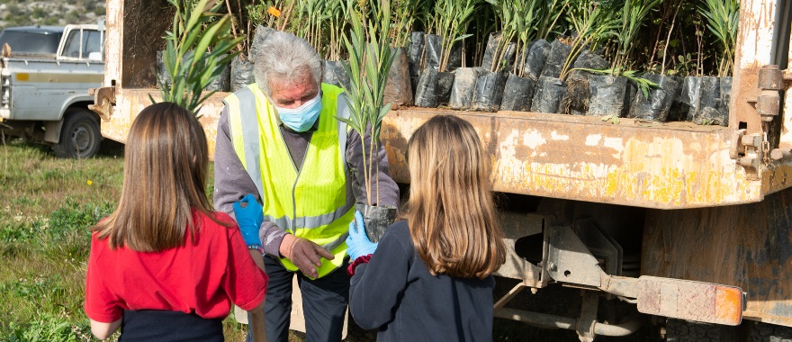 Psychico College Elementary School students participate in a volunteer tree planting initiative on Hymettus