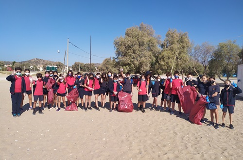 Psychico College Elementary School grade 6 students volunteer in a beach cleanup in Varkiza