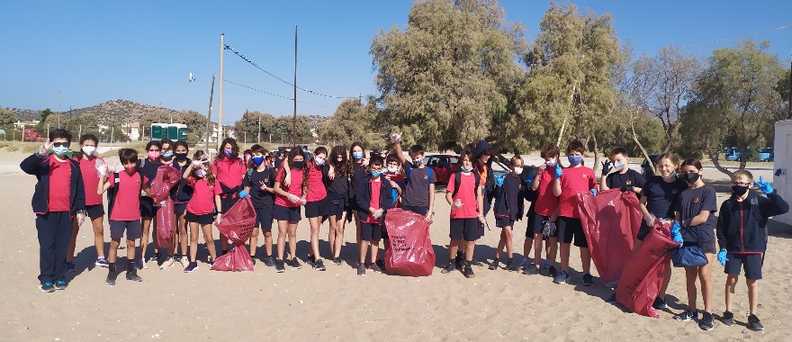 Psychico College Elementary School grade 6 students volunteer in a beach cleanup in Varkiza
